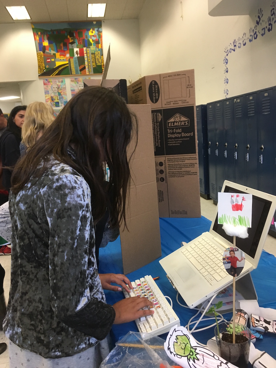 Kid checking out keybaord